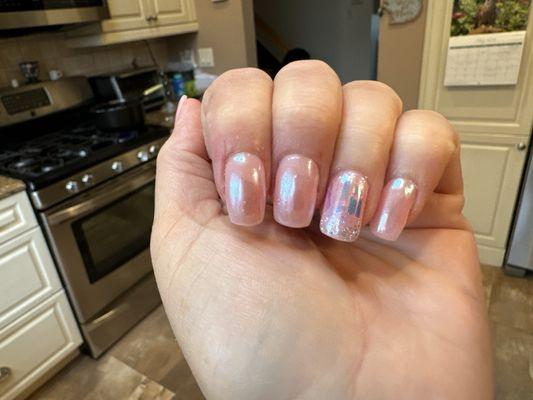 Wedding nails, which were light pink with chrome powder and glitter on the ring fingers