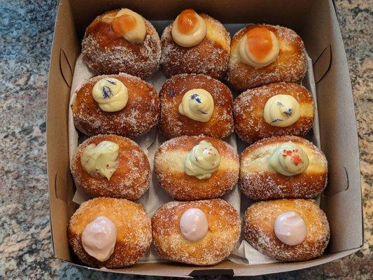 Guava, Earl Grey, Matcha Strawberry, and Hawaiian Hibiscus malasadas