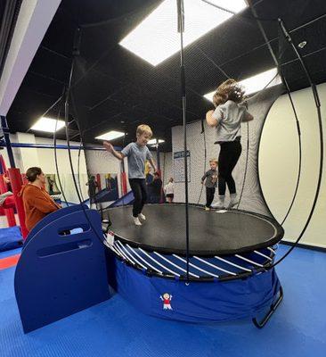 Building lower body strength, the trampoline also helps teach balance, vestibular perception & helps improve proprioception.