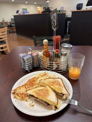 Breakfast sandwich with hashbrowns and fresh squeezed oj