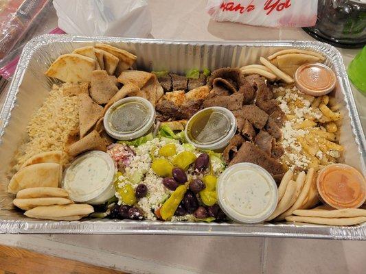 Dinner party tray.  Chicken & lamb souvkaki, chicken & beef/lamb gryo meat, rice, Greek fries, Greek salad,  & more