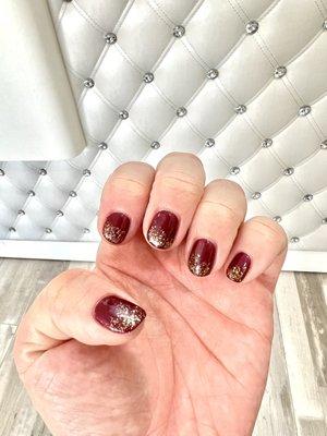 Gel by Christine. Numbers 701 "Wanna Wine" and 546 (gold glitter, I forgot the name).