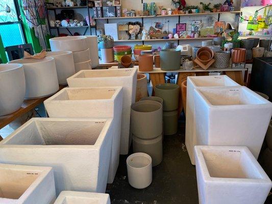 The white sleek planters are indoor only, many more ceramics and pottery, ceramic hanging pots too.