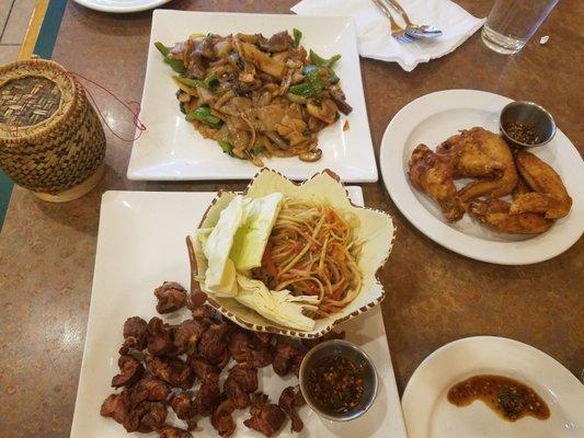 Delicious Drunken Noodle, Papaya Salad, Giblets with flavor-bursting dipping sauce!