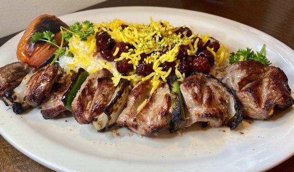 Lamb Kabob with rice topped with cherries