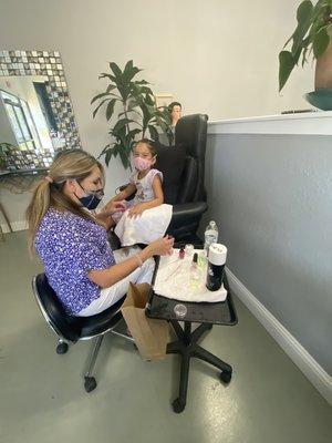 Patty finishing a manicure and pedicure