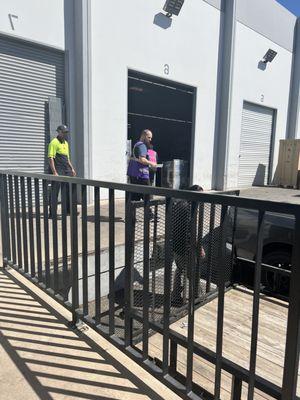 Here is the staff helping load and Mr. Victor on the bottom helping close the ramp to trailer and making sure we have everything.