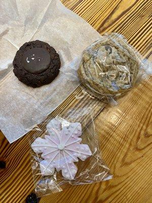 A sampling of their cookies- triple chocolate, funfetti sandwich, and iced snowflake sugar cookie