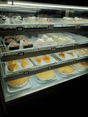 Case of more cakes, flan, bread pudding, tres leches, and templeque