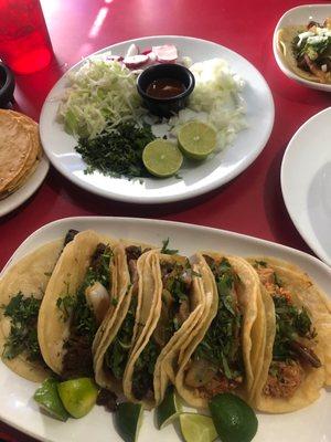 That garnish plate was for the pozole.so many limes that are cut for efficient use! Brisket y Al pastor tacos