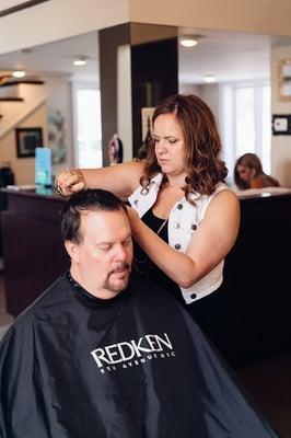 Anna during a male haircut