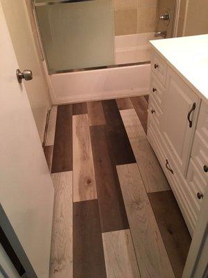 Bathroom floor had faux-hardwood snapping planks. At the price we paid, we should have had hardwood.