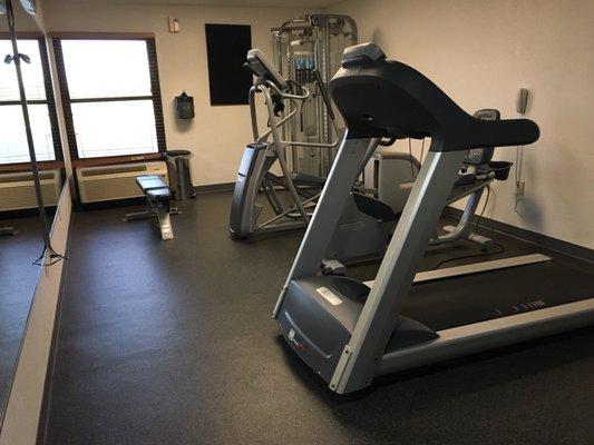 The entire fitness room. At least it has hard ceiling. No dumbbells but there's a bench.