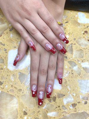 Straight tips acrylic, red French tips, rhinestones and 3D flower