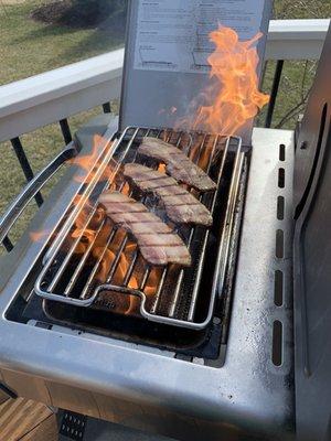 Searing bacon.