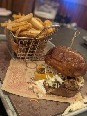 The Motley Crew Pulled pork sandwich and trio of fries