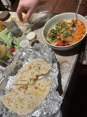 Naan, saag panner, and biryani, as seen as takeout eatten in my house