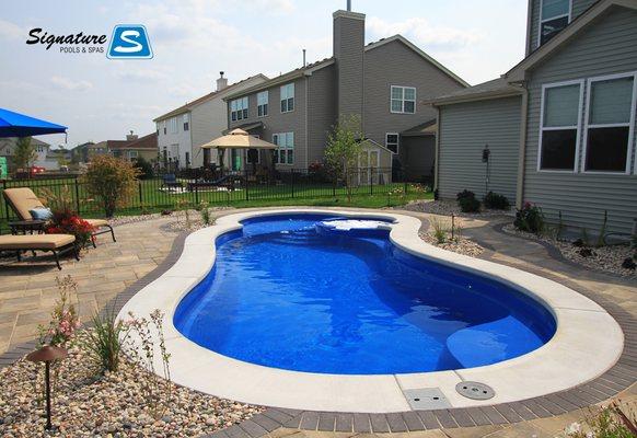 Signature Pool in Pingree Grove, IL. This Signature Fiberglass Pool is 35' x 14' 8" and is called the Allure 35.