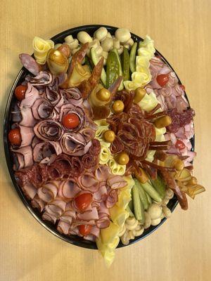 Platter with mixed vegetables meat and cheese