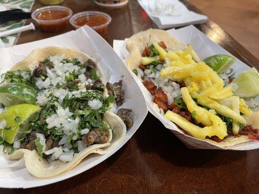 Steak tacos and Al pastor tacos, al pastor was better tortillas need help.