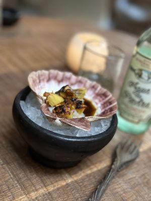 Stongington Scallop with roasted pineapple (sliced table side), spiced longaniza oil, burnt garlic ash