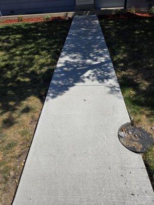 The walkway has a cutout for the water meter