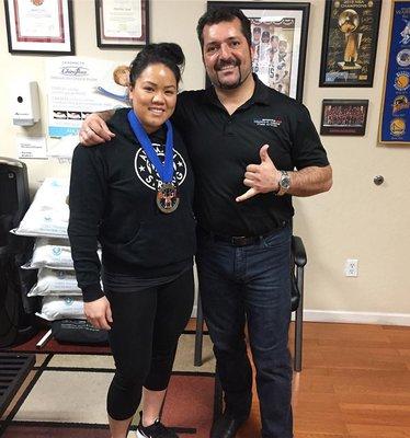 Dr. Nejad with powerlifter Traviz Cabatingan