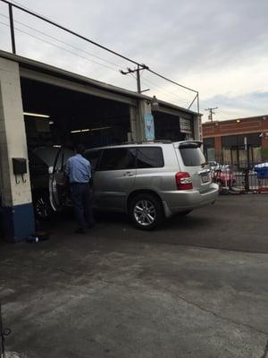 My car being checked out by the Cantonese speaking mechanics!