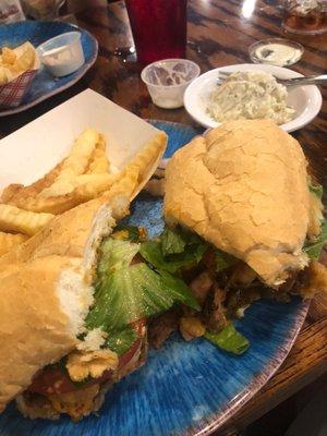 Shrimp Conucceh Sandwich with fries and potato salad