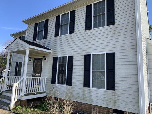 Mold grows on the house where the sun doesn't hit it.