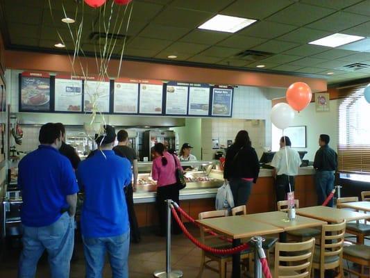 Order counter and menu on the wall.