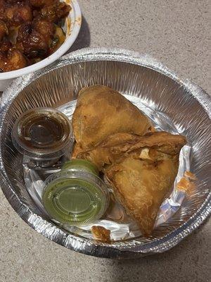 Samosa Fried pastry with a savory filling of spiced potatoes and green peas. A pocket bursting with flavor.