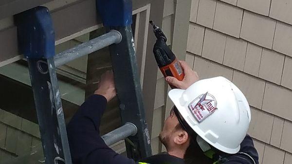 Vinyl window repair being performed by a VinylDoc technician