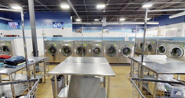 Many folding tables and laundry carts