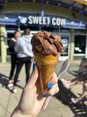 Chocolate ice cream in a pretzel cone