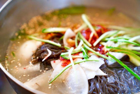 biteofyourworld: Cold noodles in chilled broth (mul naengmyeon) are a must order at Yuchun  Season to taste with vinegar and horseradish