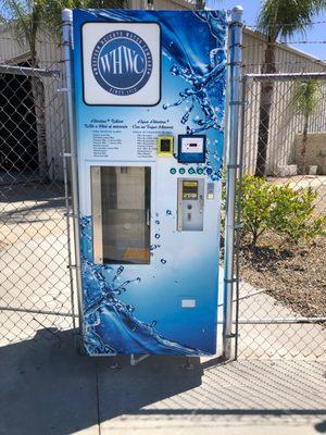 Our new alkaline water vending machine is located just outside our office on the corner of Avenue D and 15th street. Bottles not provided.