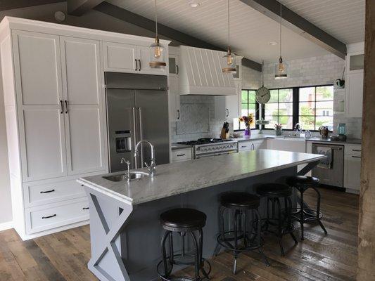 Shaker door style with white and grey conversion varnish finish.