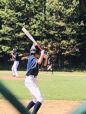 Trees are the fences over at this baseball field