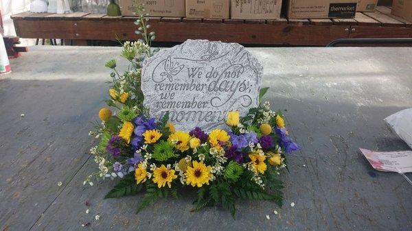 Concrete stepping stone with fresh flowers