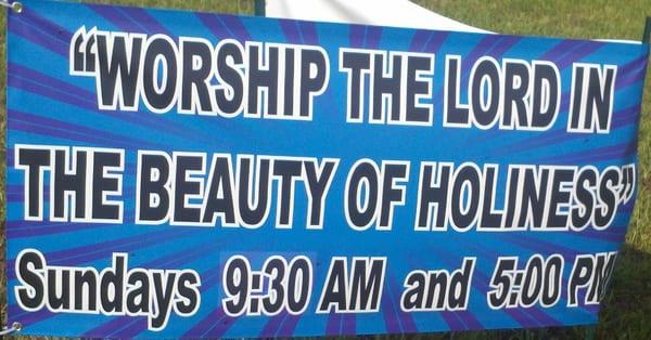 A banner that calls for worship to be holy.