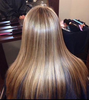 Multidimensional color with blonde highlights and low lights. Client wanted a natural look!