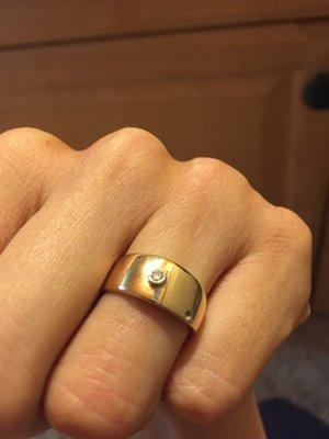 My mother's original wedding ring turned into a solid band with the only remaining side stone. And resized. So happy!