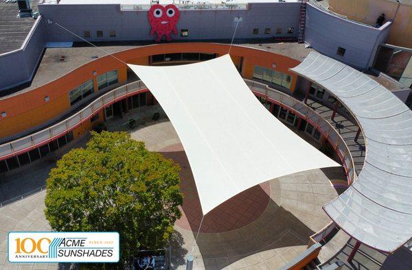 Custom-made sail, connected by cables at each corner, floats above the Children's Creativity Museum in San Francisco.