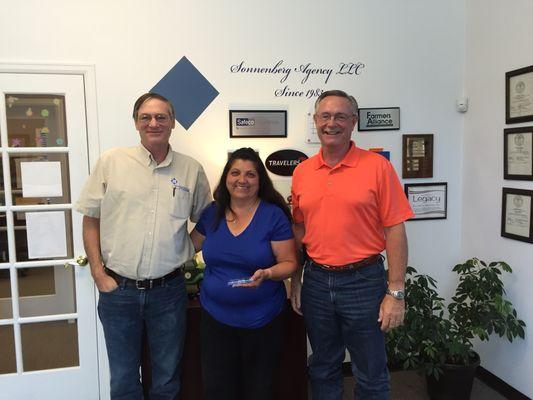 Renee, Tim & Sam pausing for quick picture to celebrate Renee's 5-year anniversary with the company.