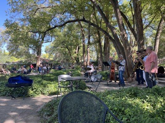 Jazz band serenading fans, newcomers and old alike.