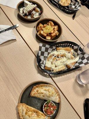 Sweet Plantains, Queso Frito with Pineapple Sauce, Yuca Fries, and Champiñón Empanadas