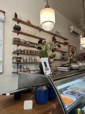 Behind the counter. Not pictured is their kitchen which is within view when you walk into the restaurant!