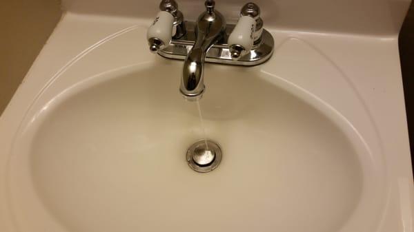 Sink in bedroom  with both nobs on