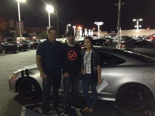 Us with our new car & the amazing auto sales man Paul! Thanks for the great expierence!